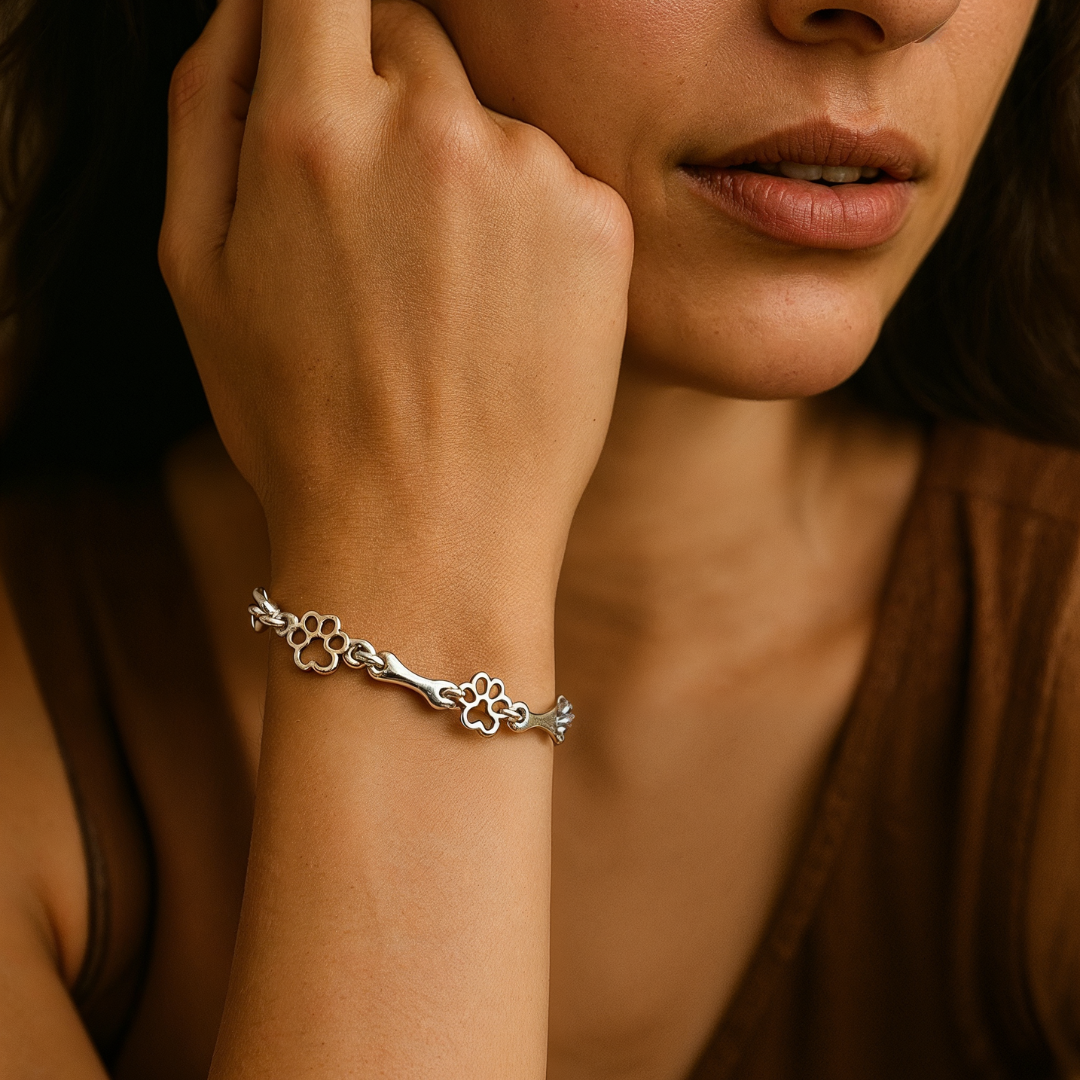 Bracelet with dog paw and bone pendants in silver