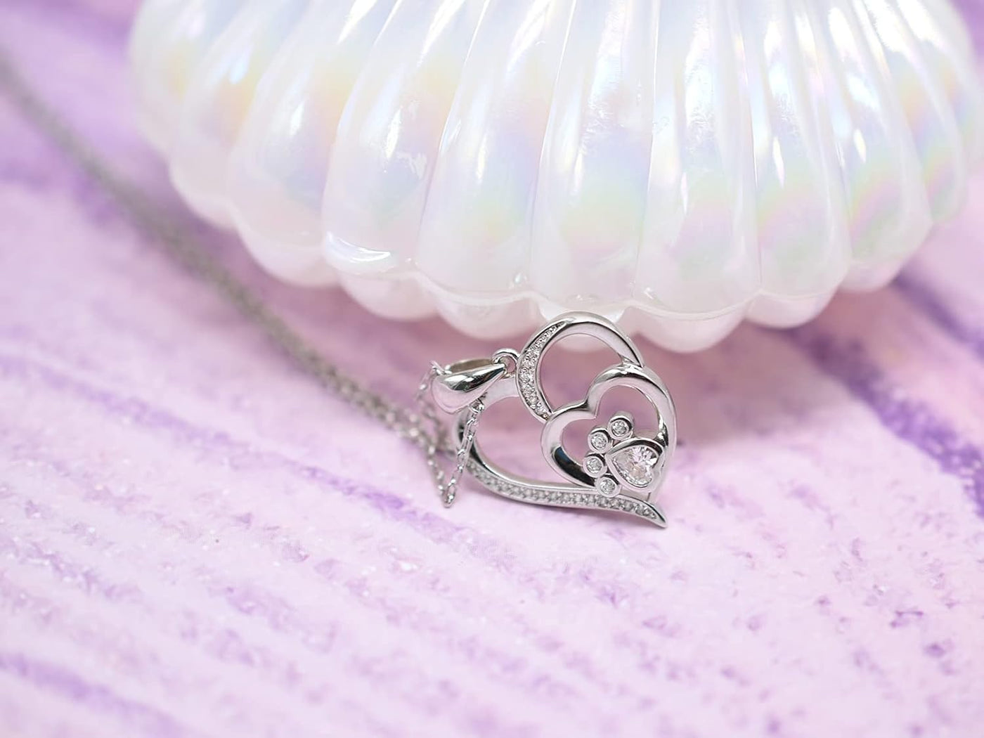 Sterling silver necklace with paw and heart with cubic zirconia