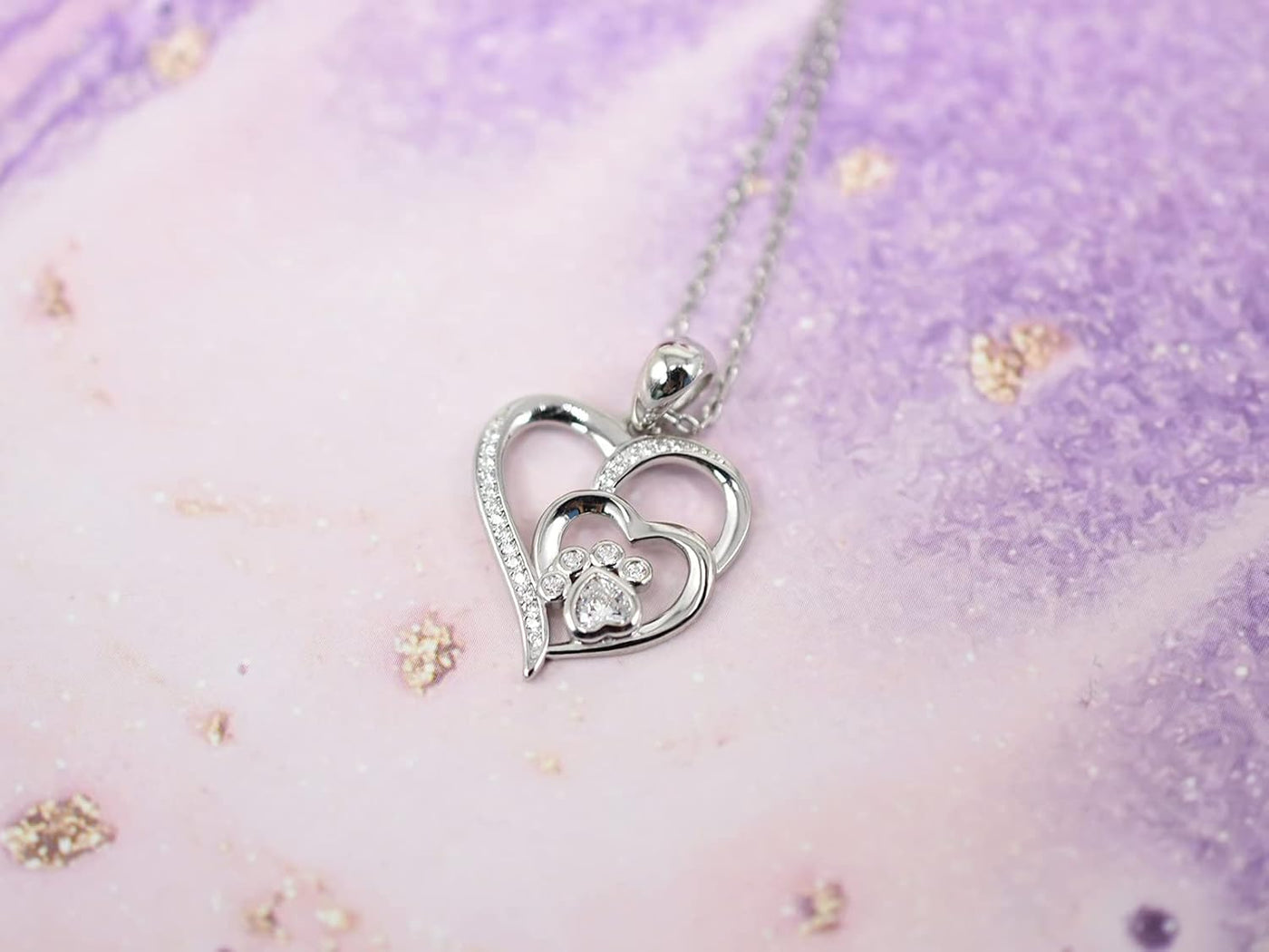 Sterling silver necklace with paw and heart with cubic zirconia