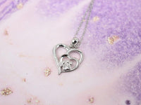 Sterling silver necklace with paw and heart with cubic zirconia