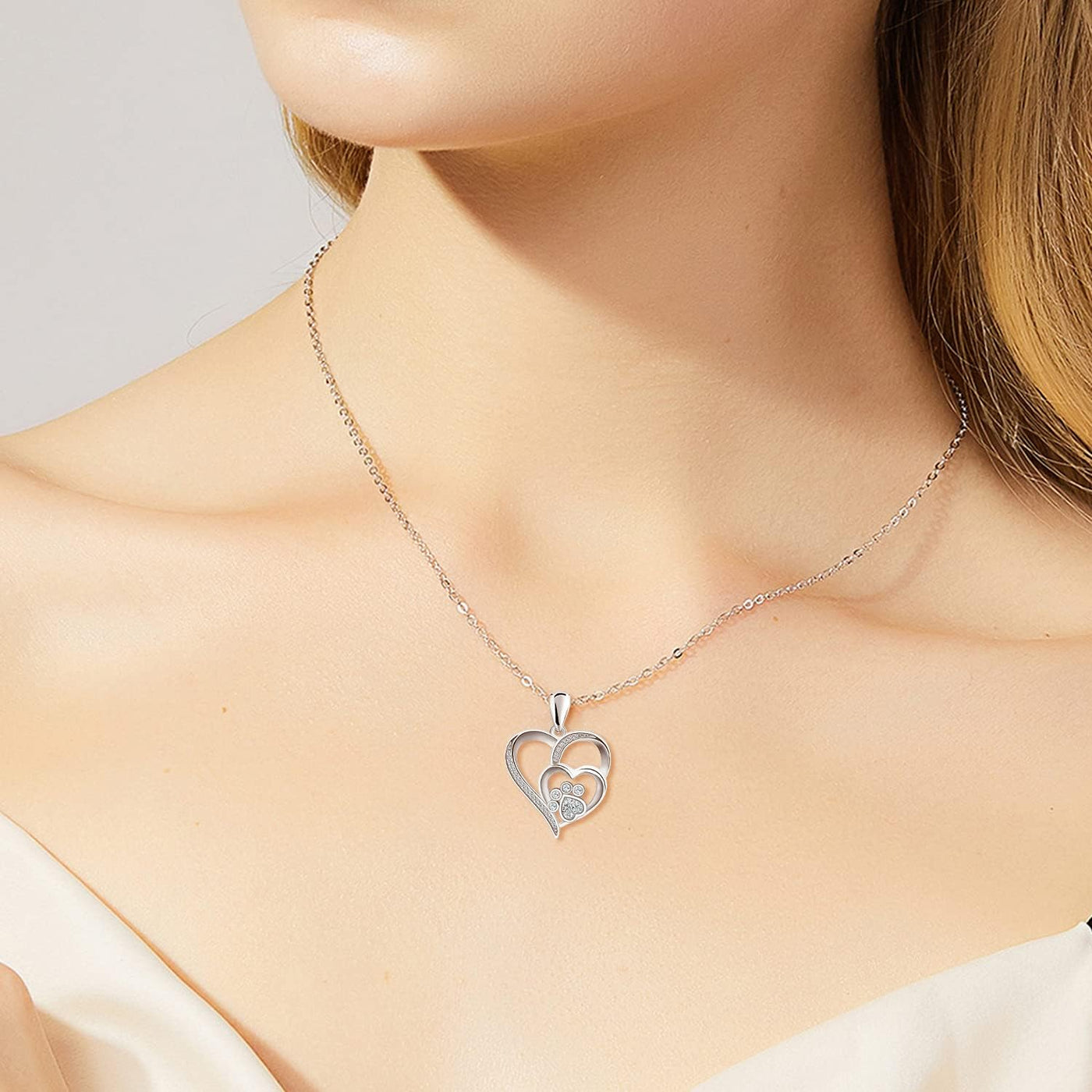 Sterling silver necklace with paw and heart with cubic zirconia