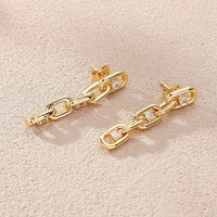 Elegant zirconia chain earrings in gold
