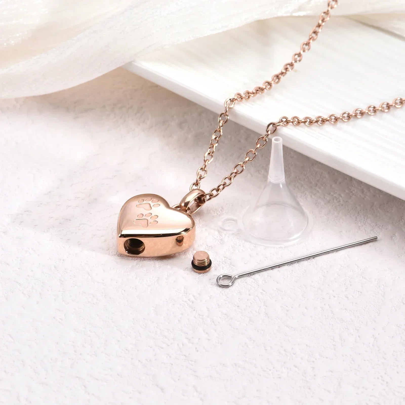 Necklace with pet memorial urn - Heart-shaped pendant with paw engraving
